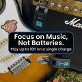 Guitar with a wireless transmitter and amplifier, featuring text about battery life.